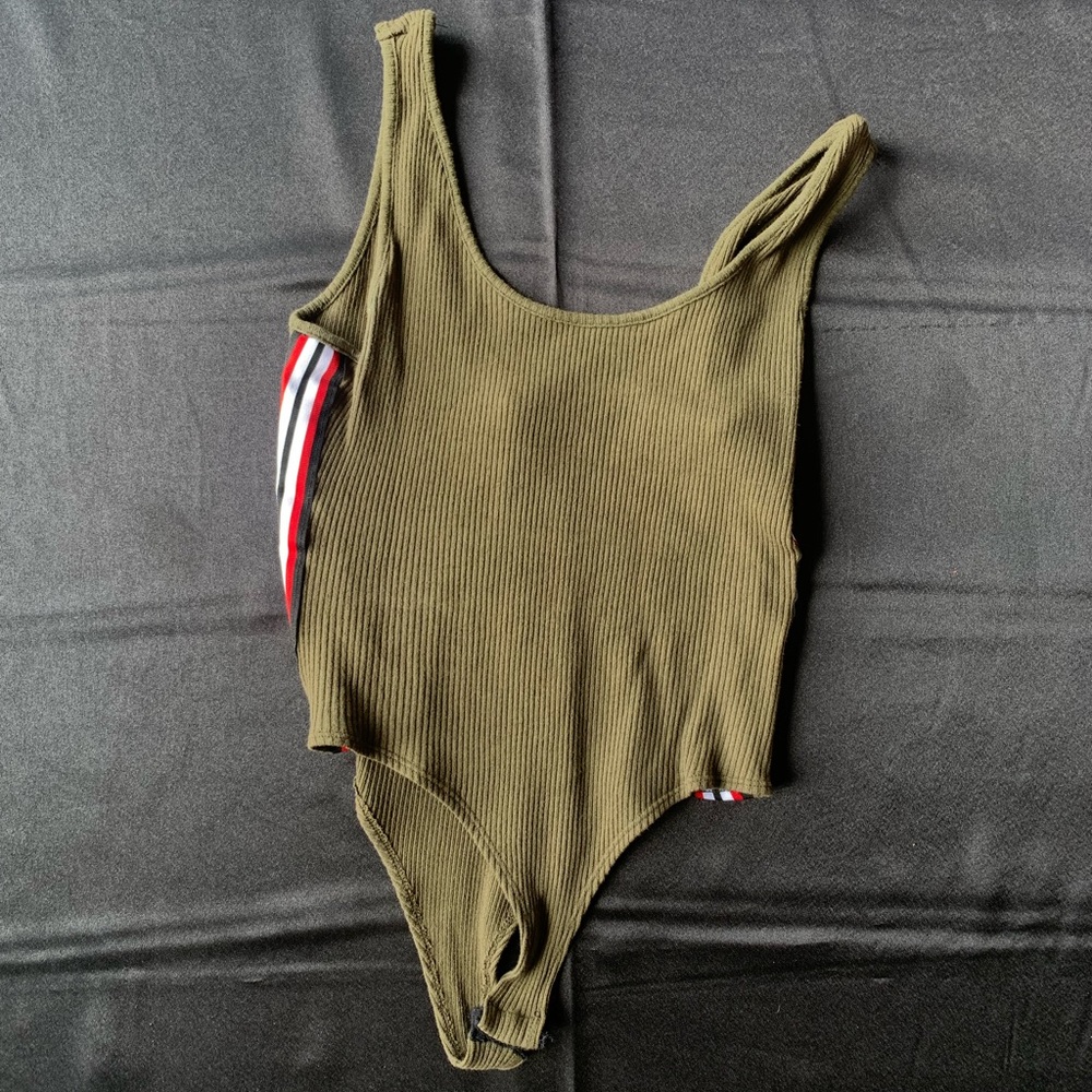 Olive green body suit with detailed sides